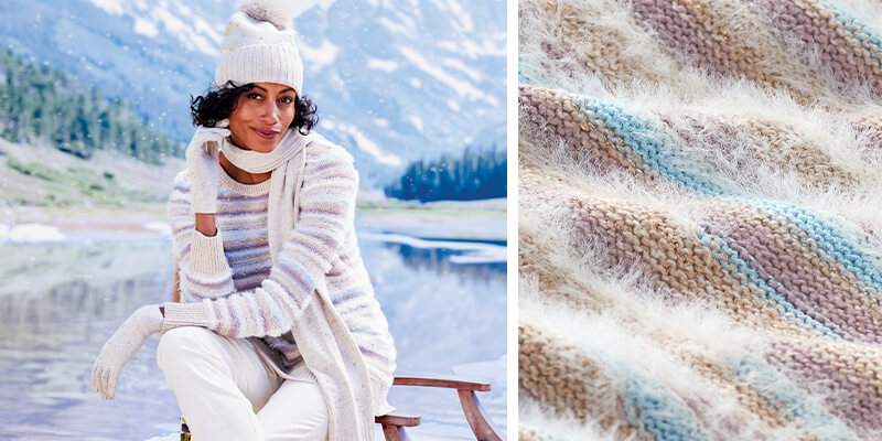 Image of a woman sitting by a mountainside lake wearing the Wrenley Stripe Sweater