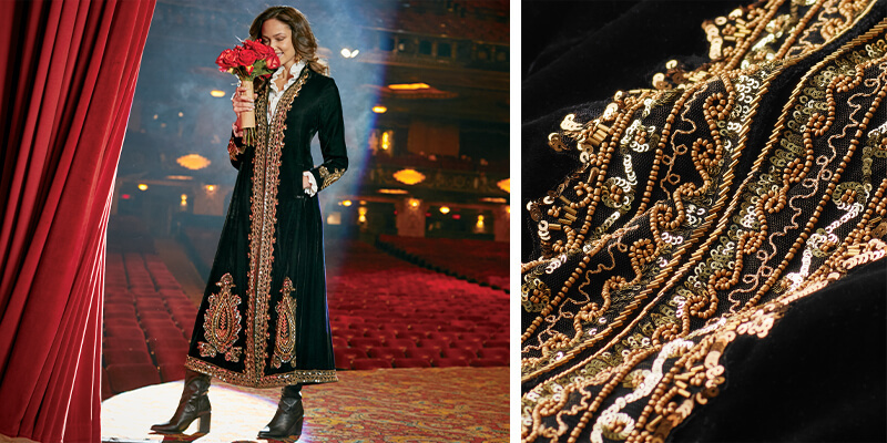 Image of a woman on a theater stage wearing the black gold embellished Heritage Duster